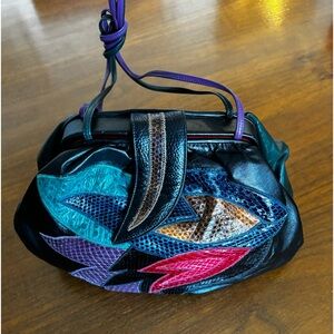 Rare SHARIF vintage clutch/shoulder bag. Leather w/exotic embellishment